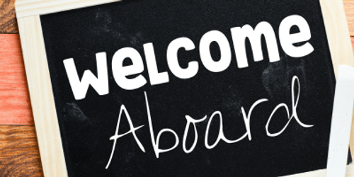 Welcome aboard sign with coffee